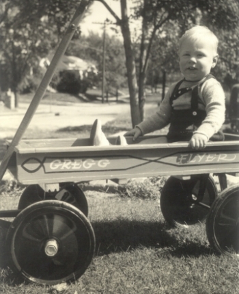 Greg in his little red wagon